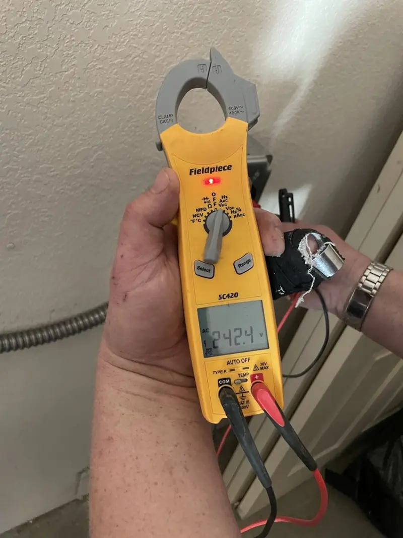 Voltage testing with clamp meter during Aluminum Wiring Replacement in Socorro